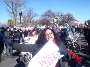 Melanie with Anti-marriage equality people in background - ironically comprised of mostly minorities who had been bussed in by NOM - Photo by Cath Kristofferson