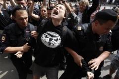 Russian police detain a gay rights activist during a rally outside the Duma, the lower house of Parliament. REUTERS/Maxim Shemetov