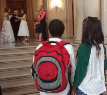 Mari and Cara watch on at San Francisco City as another couple gets married